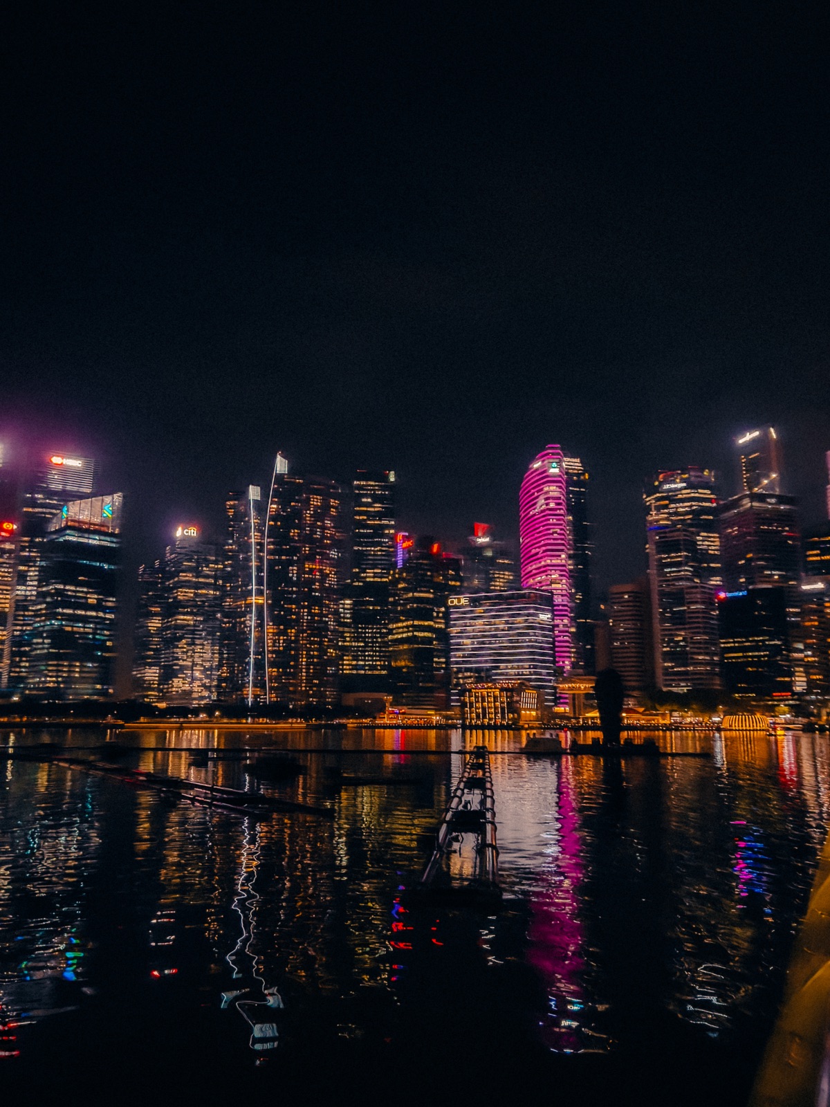 A night scene shot on iPhone showing clean exposure of city lights and ambient glow